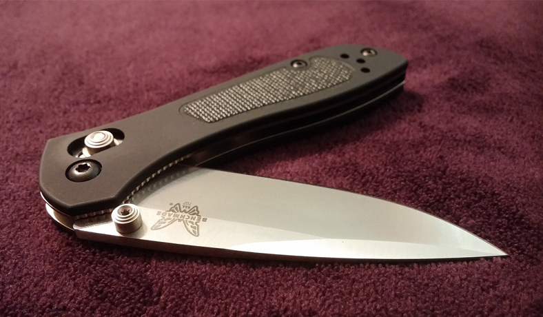 image of folding tactical knife on red carpet