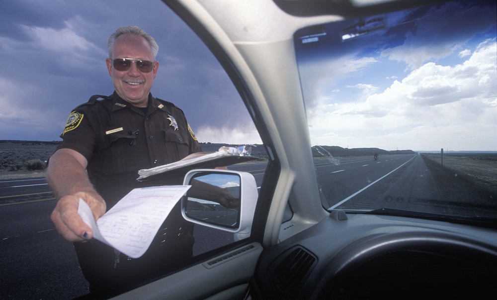 highway patrolman gives a speeding ticket